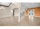 Open-concept living room with tiled floors, decorative pillars, and modern lighting fixtures at 465 Ne 155Th Street Rd, Citra, FL 32113