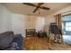 Comfortable living room with a fireplace and carpet flooring at 465 Ne 155Th Street Rd, Citra, FL 32113