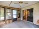 Spacious enclosed patio with access to the backyard, providing additional living space at 465 Ne 155Th Street Rd, Citra, FL 32113