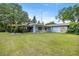 Property featuring a covered carport with a large lawn at 465 Ne 155Th Street Rd, Citra, FL 32113