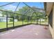 Spacious screened lanai offers a relaxing outdoor living area with views of the backyard at 465 Ne 155Th Street Rd, Citra, FL 32113