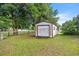 Exterior view of the storage shed in the backyard of this home at 465 Ne 155Th Street Rd, Citra, FL 32113