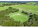 Aerial view of expansive property with barn, home, pasture and horse fencing at 5330 Ne 111Th Lane Rd, Anthony, FL 32617
