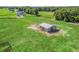 Aerial view of barn surrounded by green pasture and horse fencing at 5330 Ne 111Th Lane Rd, Anthony, FL 32617