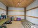 View of barn interior with metal siding, wood framing, and assorted containers at 5330 Ne 111Th Lane Rd, Anthony, FL 32617