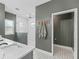 Modern bathroom with tiled floors, dual shower heads, and a spacious walk-in shower at 5330 Ne 111Th Lane Rd, Anthony, FL 32617