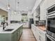 Stylish kitchen featuring a center island with sink and ample counter space at 5330 Ne 111Th Lane Rd, Anthony, FL 32617