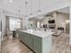 Open concept kitchen island with quartz countertops overlooking the dining and living areas at 5330 Ne 111Th Lane Rd, Anthony, FL 32617