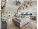 Bright open concept living room and kitchen with hardwood floors and high ceilings at 5330 Ne 111Th Lane Rd, Anthony, FL 32617