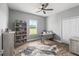This office features stylish wood-look flooring, neutral walls, a ceiling fan, and great natural light at 5330 Ne 111Th Lane Rd, Anthony, FL 32617