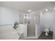 Bathroom featuring a corner shower, bathtub, and toilet at 5661 Nw 96Th Ln, Ocala, FL 34482