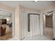 Bright bathroom featuring tile flooring and a shower with a white curtain at 5661 Nw 96Th Ln, Ocala, FL 34482