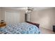 Bedroom featuring a bed, ceiling fan, and closet at 5661 Nw 96Th Ln, Ocala, FL 34482