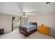 Bedroom featuring a window, bed, and dresser at 5661 Nw 96Th Ln, Ocala, FL 34482