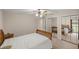 Bedroom featuring a bed and closets at 5661 Nw 96Th Ln, Ocala, FL 34482