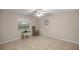 Bedroom featuring a chair and window at 5661 Nw 96Th Ln, Ocala, FL 34482