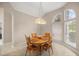 Charming dining room with a wooden table, traditional chairs, and a decorative chandelier at 5661 Nw 96Th Ln, Ocala, FL 34482