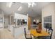 Cozy breakfast nook open to the kitchen and Gathering room with a breakfast table, tile floors, and neutral paint at 5661 Nw 96Th Ln, Ocala, FL 34482