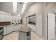 Bright kitchen with white cabinets, stainless appliances, granite counters, and skylights for natural light at 5661 Nw 96Th Ln, Ocala, FL 34482