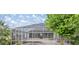 Screened-in pool area with ample seating space, perfect for outdoor entertaining at 5661 Nw 96Th Ln, Ocala, FL 34482