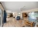 Inviting sunroom with tile floors, ceiling fans, and expansive sliding glass doors to the outdoor area at 5661 Nw 96Th Ln, Ocala, FL 34482