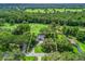Gorgeous aerial view of property backing on to the golf course and lush landscaping at 5714 Nw 80Th Avenue Rd, Ocala, FL 34482