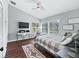 Bright bedroom with hardwood floors, vaulted ceilings, and a dedicated work space with lots of light at 5714 Nw 80Th Avenue Rd, Ocala, FL 34482