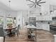 Bright, open kitchen featuring modern appliances, an island, and a breakfast nook with views of the pool at 5714 Nw 80Th Avenue Rd, Ocala, FL 34482
