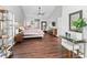 Bright and spacious main bedroom with wood floors, large windows, and ample space for a seating area at 5714 Nw 80Th Avenue Rd, Ocala, FL 34482