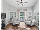 Comfortable sitting room area adjacent to the main bedroom with plush armchairs and views of the pool at 5714 Nw 80Th Avenue Rd, Ocala, FL 34482