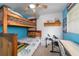 Cozy bedroom features unique bunk beds, wooden shelves, and modern desk at 6060 Se 119Th Pl, Belleview, FL 34420