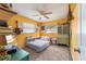 Bright bedroom features unique floor mattress, bohemian rug, and cozy decor at 6060 Se 119Th Pl, Belleview, FL 34420