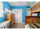 Cozy bedroom features bunk beds, closet, and wooden dresser with lamp at 6060 Se 119Th Pl, Belleview, FL 34420