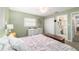 Bedroom with closet, carpet, dresser, and natural lighting at 6060 Se 119Th Pl, Belleview, FL 34420