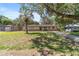 Lovely one-story home with brick accents, a green lawn, and a mature tree in the front yard at 6060 Se 119Th Pl, Belleview, FL 34420