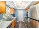 Well-lit kitchen featuring stainless steel appliances, light-colored countertops, and ample cabinet space at 6060 Se 119Th Pl, Belleview, FL 34420
