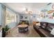 Inviting living room with comfortable seating and plenty of natural light at 6060 Se 119Th Pl, Belleview, FL 34420