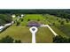 An aerial view shows a sprawling property with manicured lawns and a long driveway at 6160 W Highway 326, Ocala, FL 34482