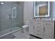 Modern bathroom with a glass walk-in shower, stylish vanity, and sleek fixtures at 6160 W Highway 326, Ocala, FL 34482