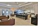 Open-concept kitchen featuring a large island with bar seating and modern appliances at 6160 W Highway 326, Ocala, FL 34482