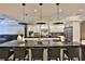 Stylish kitchen with a spacious island, sleek black countertops, and modern stainless steel appliances at 6160 W Highway 326, Ocala, FL 34482