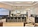 Bright and airy kitchen featuring a large island with seating and contemporary white cabinetry at 6160 W Highway 326, Ocala, FL 34482