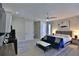 Bright studio living space with a modern kitchenette, neutral walls, and tiled floors at 6160 W Highway 326, Ocala, FL 34482