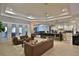 Spacious living room with two couches adjacent to the kitchen, creating a perfect entertainment space at 6160 W Highway 326, Ocala, FL 34482