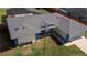 Aerial view of the house showing the roof, lawn, and driveway at 6211 Se 126Th St, Belleview, FL 34420