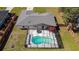 Overhead view of home, highlighting the screened-in pool and surrounding backyard at 6211 Se 126Th St, Belleview, FL 34420