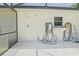 Outdoor shower and sink area near screened-in lanai, perfect for rinsing off after a swim at 6211 Se 126Th St, Belleview, FL 34420