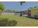 Lush backyard featuring a screened-in pool with an umbrella and plenty of room for activities at 6211 Se 126Th St, Belleview, FL 34420