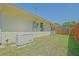A view of the backyard that shows the generator, air conditioning unit and fence at 6211 Se 126Th St, Belleview, FL 34420