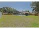 Large backyard featuring a screened-in pool and storage shed at 6211 Se 126Th St, Belleview, FL 34420